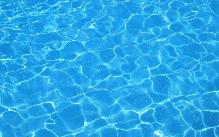 Crisp Blue Swimming Pool Water Surface With Sunlight Caustics and Ripples HD wallpaper