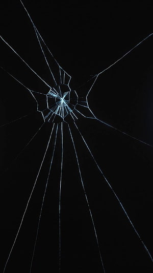 Shattered Glass Fracture Pattern on Black Background HD phone wallpaper