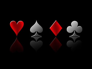 Glossy Playing Card Suits with Reflections on Black Background HD wallpaper