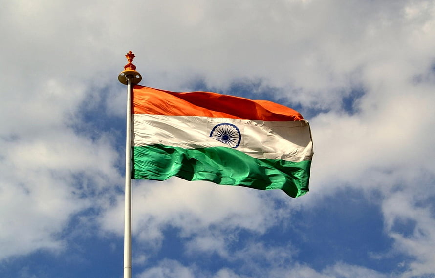 Indian National Flag Waving Against a Blue Sky With Scattered Clouds HD wallpaper