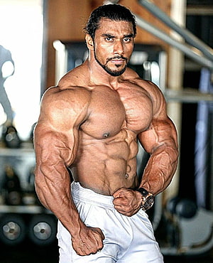 Muscular Indian Bodybuilder Poses in Gym with Defined Abs and Veins HD phone wallpaper