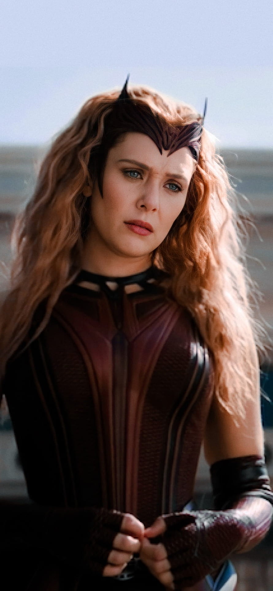 Wanda Maximoff in Scarlet Witch Costume with Horned Headpiece and Flowing Red Hair HD phone wallpaper
