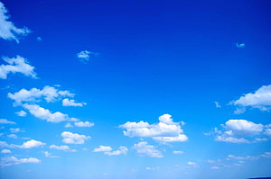 Vast Azure Sky With Scattered White Cumulus Clouds and Bright Sunlight HD wallpaper