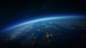 Earth at Night Viewed from Orbit with City Lights and Starry Space HD wallpaper