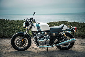 Royal Enfield Continental GT 650 Custom Cafe Racer Parked on Coastal Dunes HD wallpaper