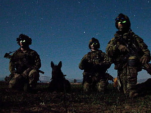 US Army Rangers and Military Working Dog on Night Patrol Under Starry Sky HD wallpaper