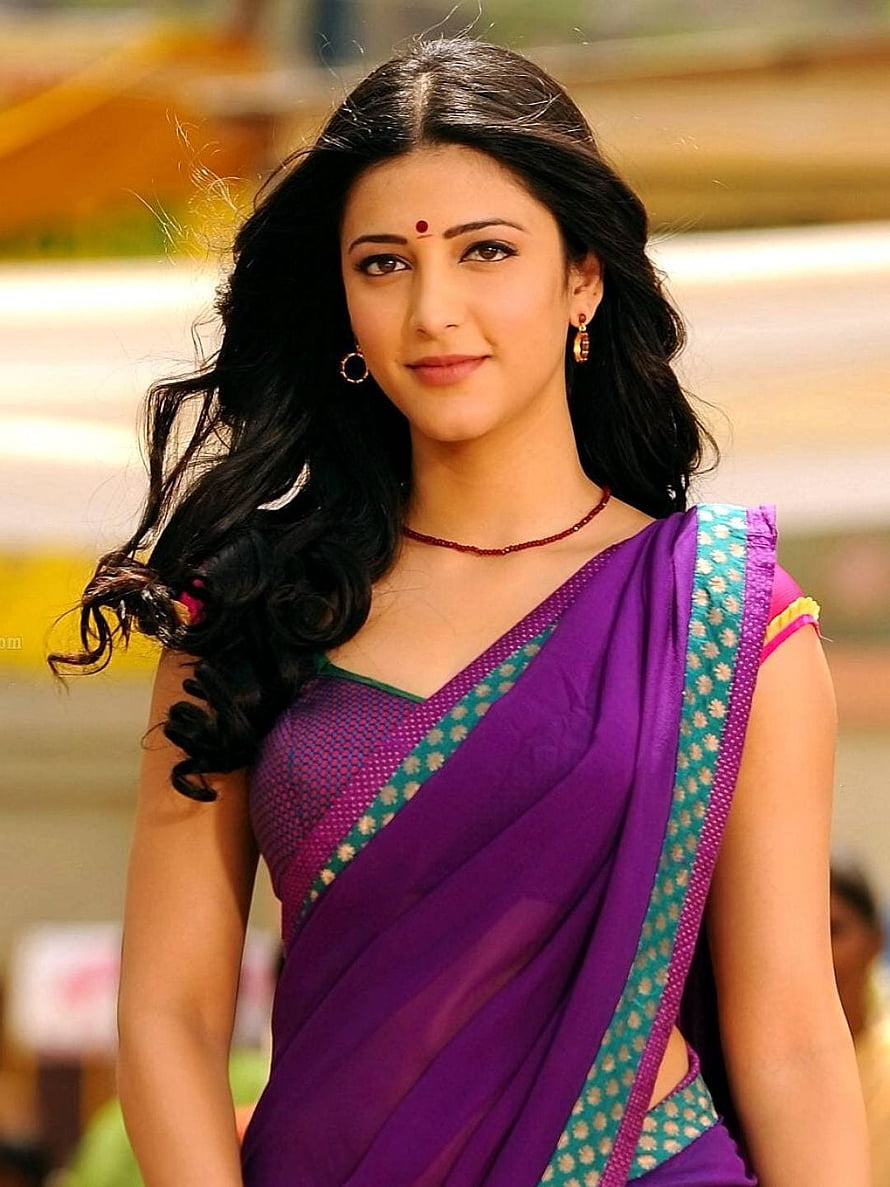 Shruti Haasan in a vibrant purple sari with teal border and traditional jewelry HD phone wallpaper