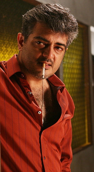 Ajith Kumar in Mankatha wearing a red pinstripe shirt with a cigarette HD phone wallpaper