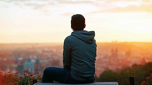 Man in Grey Hoodie Sitting Alone on a Bench Overlooking a City at Sunset, Sad Boy For Facebook Profile or Whatsapp, alone boy HD wallpaper