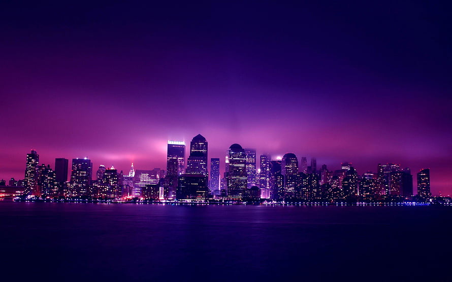 Vibrant Purple Skyline at Night with City Lights Reflecting on Water HD wallpaper