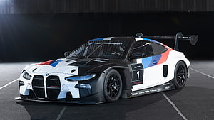 BMW M4 GT3 Race Car with Motorsport Livery and Number One on Track HD wallpaper