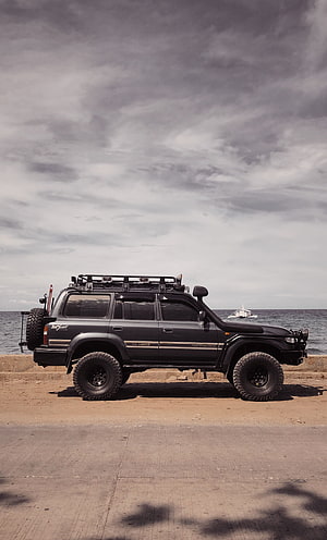 Black Toyota Land Cruiser 79 Series VX Limited Off-Road SUV Parked by the Sea HD phone wallpaper
