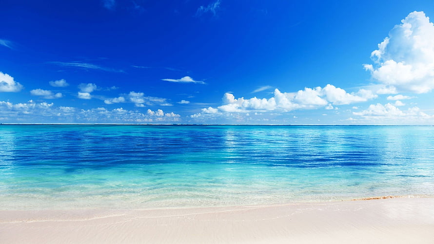 Serene Tropical Beach with Turquoise Water and White Sand Under a Bright Blue Sky HD wallpaper