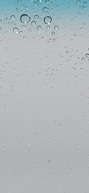 Raindrops on a Glass Window Against a Soft Grey Sky HD phone wallpaper