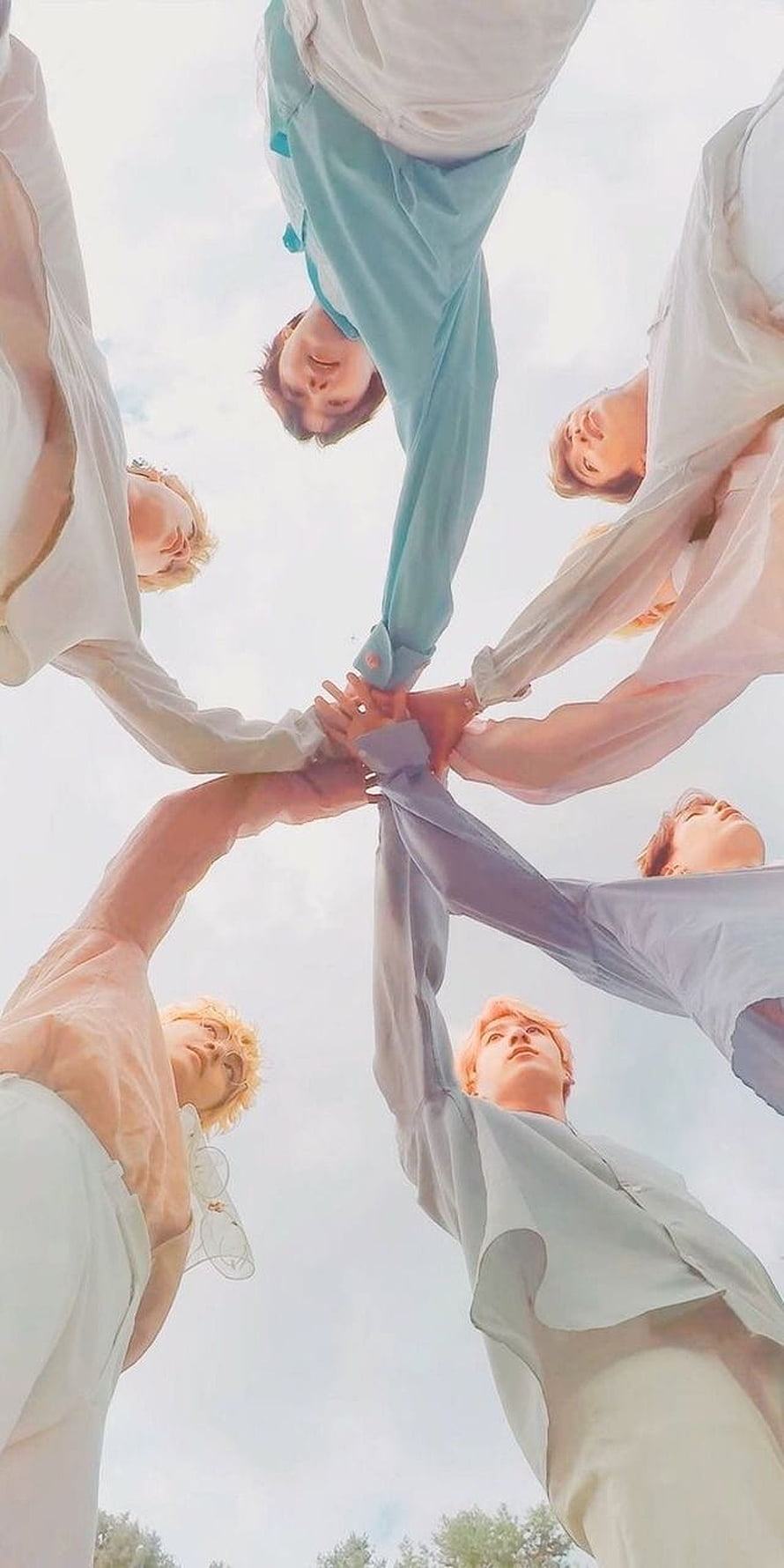 BTS Members Stacked Hands in Circle Under Bright Sky HD phone wallpaper