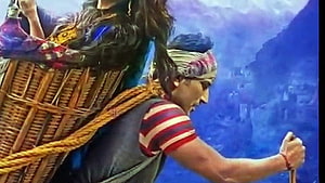 Kedarnath Movie Still of Pilgrim Carrying Basket on Mountain Trail HD wallpaper