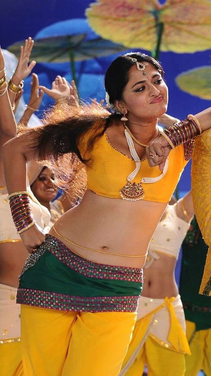 Anushka Shetty in Vibrant Yellow and Green Traditional Dance Costume HD phone wallpaper