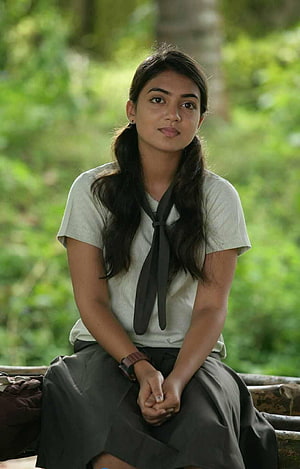 Nazriya Nazim in Om Shanti Oshana Sitting on a Bench in a Lush Green Forest HD phone wallpaper