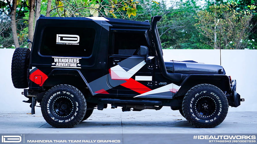 Mahindra Thar SUV with Team Rally Graphics and Off-Road Tires HD wallpaper