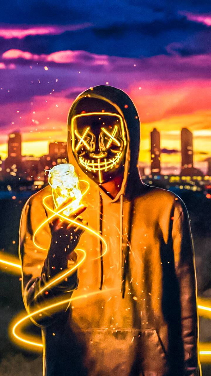 Hacker in Glowing Neon Mask Holding Electric Orb Against Vibrant City Skyline HD phone wallpaper