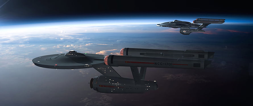 Star Trek Enterprise NCC-1701 and Constellation-class starships orbiting a planet in deep space HD wallpaper