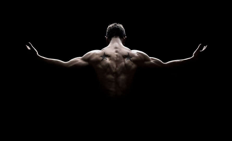 Muscular Male Back View With Star Tattoos Against Black Background HD wallpaper