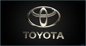 Sleek Metallic Toyota Emblem on Dark Textured Background HD wallpaper