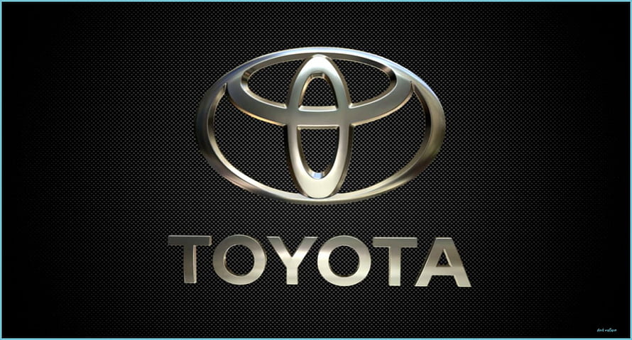 Sleek Metallic Toyota Emblem on Dark Textured Background HD wallpaper