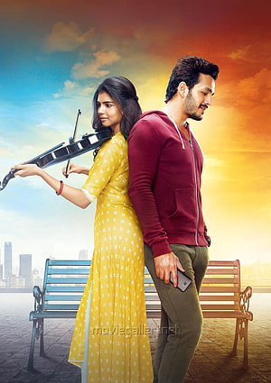 Hello Movie Poster Featuring Couple With Violin And Smartphone Against Sunset Sky HD phone wallpaper