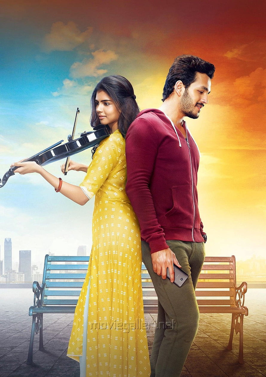 Hello Movie Poster Featuring Couple With Violin And Smartphone Against Sunset Sky HD phone wallpaper
