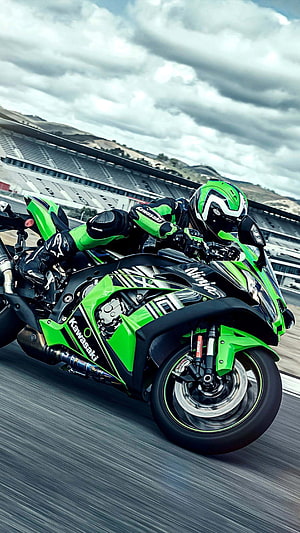 Kawasaki Ninja ZX-10R KRT Racing Motorcycle Leaning Into a Turn on a Circuit Track HD phone wallpaper