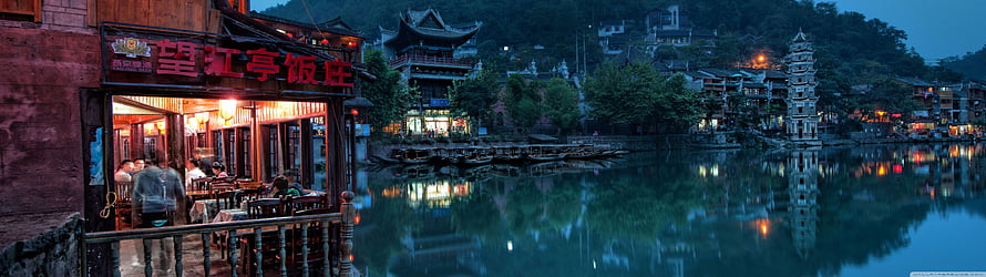 Fenghuang Ancient Town Riverside at Dusk with Traditional Chinese Architecture and Lanterns HD wallpaper