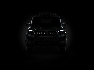 Mahindra Scorpio Front View in Dramatic Dark Lighting with Glowing LED Headlights HD wallpaper