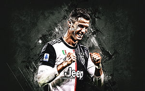 Cristiano Ronaldo in Juventus Kit Celebrating with Fists Clenched on Dark Textured Background HD wallpaper
