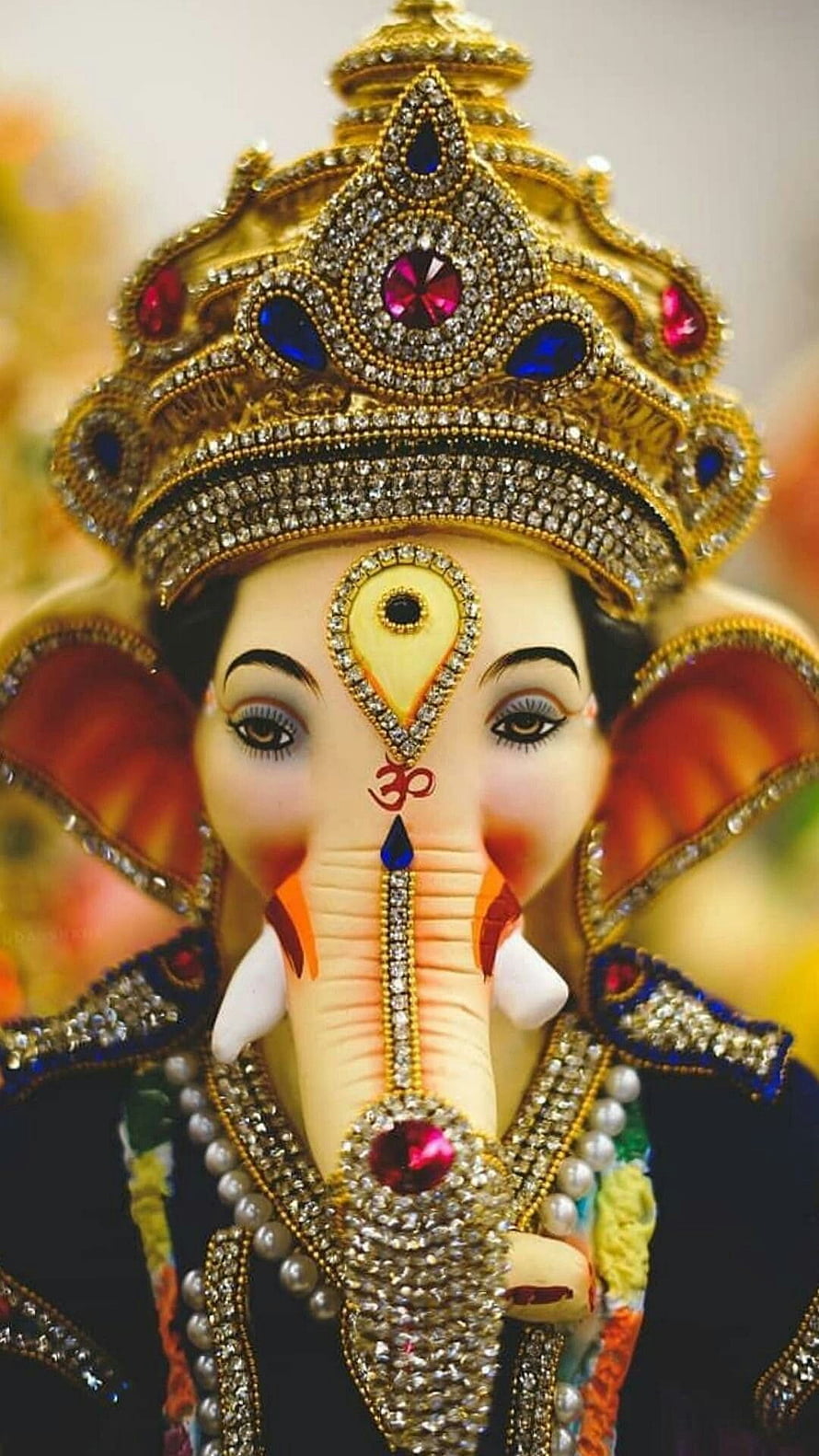 Ganesha Ornate Crown and Jewelry Close-Up Portrait HD phone wallpaper