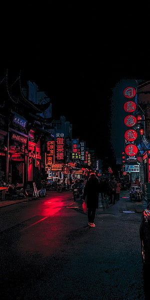 Neon-Lit Chinese Street at Night with Red Signage and Pedestrians HD phone wallpaper