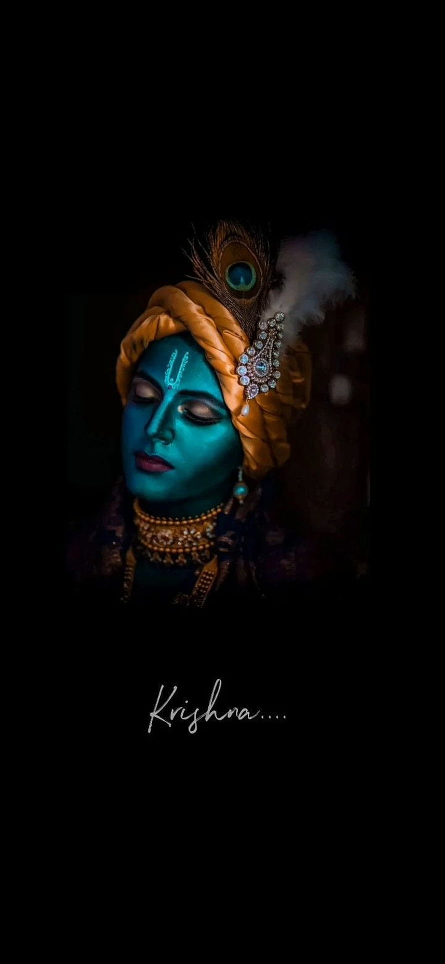 Lord Krishna Portrait with Peacock Feather Crown and Turquoise Face Paint HD phone wallpaper