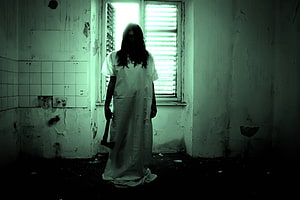 Eerie Silhouette of a Woman in a White Dress Holding an Axe in a Decaying Room HD wallpaper