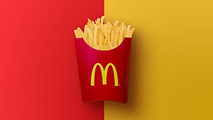 McDonald's French Fries in Red Container on Split Red and Yellow Background HD wallpaper