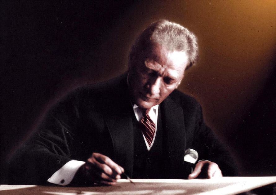 Mustafa Kemal Atatürk Writing at a Desk in a Formal Black Suit HD wallpaper