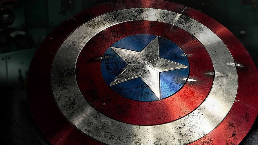 Weathered Captain America Shield Close-Up with Star Emblem and Metallic Rings HD wallpaper