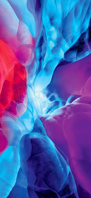 Vibrant Abstract Ice Cave with Swirling Blue, Purple, and Red Hues HD phone wallpaper