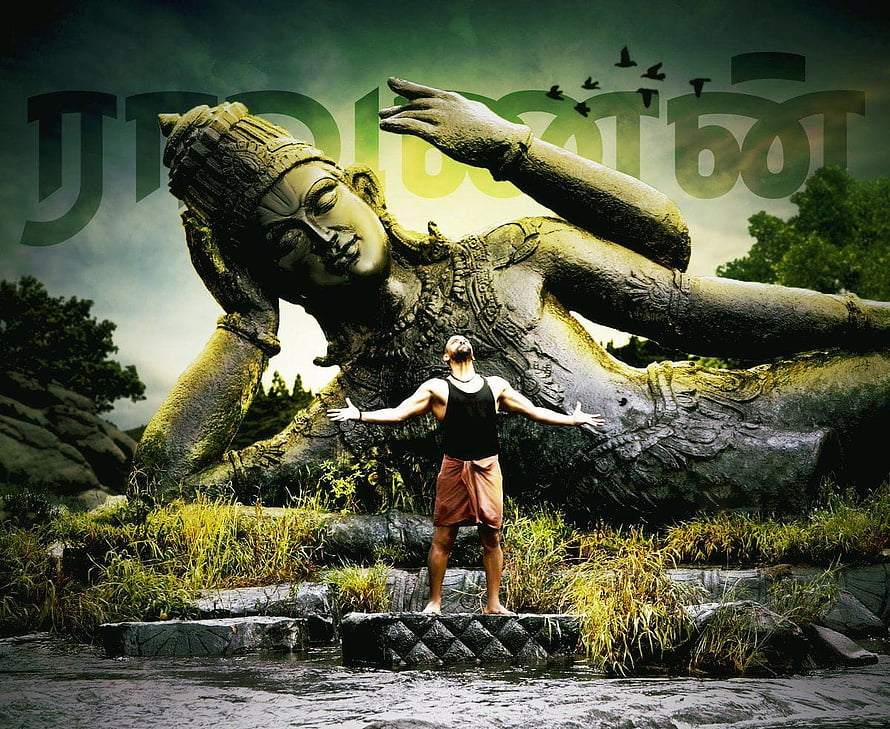 Raavanan Statue with Man Standing in River at Tamil Nadu Rock Formation HD wallpaper