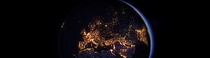 Earth at Night from Space with City Lights and Atmospheric Glow HD wallpaper