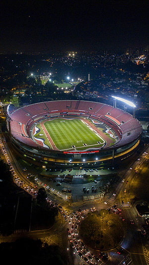 Aerial Night View of Morumbi Stadium in São Paulo with Illuminated Pitch and Surrounding City Lights HD phone wallpaper