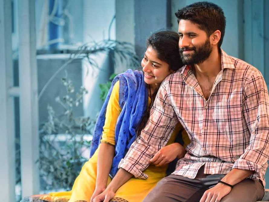Akkineni Naga Chaitanya and Sai Pallavi in a warm romantic moment HD wallpaper