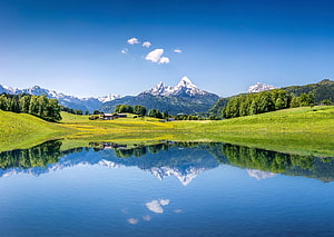 Alpine Lake Reflections and Snow-Capped Peaks in the Swiss Alps HD wallpaper
