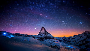 Matterhorn Peak Under a Starry Night Sky with Aurora and Snowy Alpine Landscape HD wallpaper
