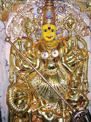 Golden Kanaka Durga Temple Idol with Lion and Ornate Jewelry HD phone wallpaper