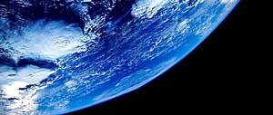 Earth From Space: Blue Planet Horizon With Swirling Clouds Against Black Void HD wallpaper